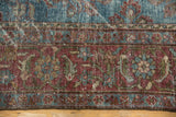 Vintage Mahal carpet: worn pile texture, time-softened aqua blue and burgundy hues.