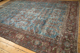 Vintage Persian Mahal carpet corner, burgundy floral border, and worn aqua blue field.