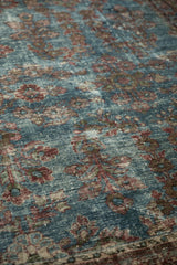 Worn pile of a circa 1930s Persian Mahal carpet featuring aqua blue and burgundy florals.