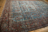 Vintage Persian Mahal carpet border featuring intricate burgundy floral patterns and gentle patina.