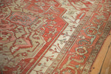 Detail of the Samovar border with stylized plant motifs on an antique Serapi carpet.