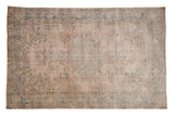Vintage Distressed Sparta rug in faded dusty rose with teal arabesque border, 6'10