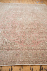 Vintage Distressed Isparta carpet's faded fringe and geometric border in dusty rose.