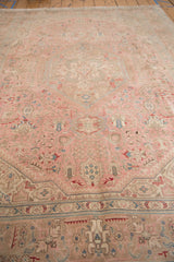 Distressed vintage Isparta rug detail: dusty rose and aqua blue geometric floral patterns.