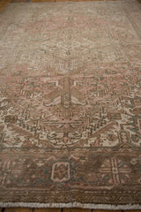Distressed vintage Mehrivan carpet pile with faded pink, beige, sea foam green geometric motifs.