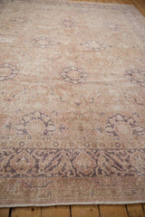 Distressed Sivas carpet with delicate arabesque border and faded floral motifs.