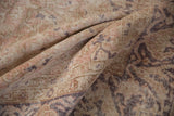 Distressed texture of a vintage Sivas carpet, showing even wear in muted floral patterns.