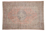 Distressed vintage Sparta rug, dusty blush field, navy roundel medallion, floral border, 7'4