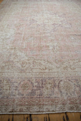 Distressed vintage Turkish Sparta carpet, showing worn pile texture and faded floral palmettes.