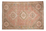 Distressed Vintage Abadeh rug features triple medallion, playful motifs in blush pink, coffee, mint green.
