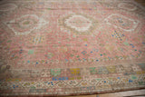 Distressed Abadeh carpet, showing faded pink pile, detailed geometric and playful field motifs.