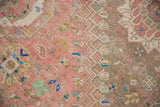 Worn pile and stepped serrated relief on distressed Abadeh rug, blush and pale brown tones.