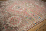 Storied patina on a distressed vintage Abadeh rug border in blush, brown, and ivory tones.