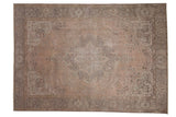 Distressed vintage Tabriz carpet with a faded peach field and muted medallion, 6'8