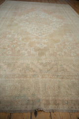 Distressed Oushak carpet pile showing soft texture and muted sandalwood and ivory shades.