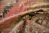 Vintage Distressed Oushak rug with dusty pink, saffron, and charcoal geometric patterns.