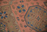 Vintage Caucasian Soumac flatweave revival design with geometric starbursts, brick red, and indigo.