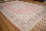 Vintage Distressed Sparta carpet's abrashed field with faded pink, mauve, and oxidized silver.