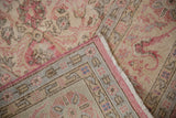 Distressed floral pile meets geometric foundation with blue details and vibrant pink selvage.
