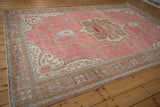 Patterned pale bronze border and intact selvage on vintage distressed Sparta rug.