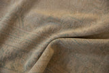 Even wear across the sandy-toned knot heads of a vintage distressed Oushak carpet.