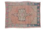 Distressed vintage Oushak rug, blush field, asymmetric medallion, seafoam and fuchsia pinwheel border.