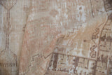 Distressed Oushak rug pile texture, ivory, beige, coffee brown geometric pattern, mostly even wear.