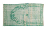 Distressed vintage Oushak rug, mint green and aqua blue, featuring a mehrab with scrolling vinery.