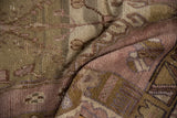 Distressed pile texture showing dusty mauve, brown, and beige abrashes on a vintage Oushak rug.