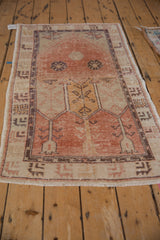 Distressed Oushak rug, lower field showing cantaloupe, ivory germinating floral motifs.
