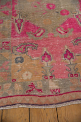 Hot pink and dusty gold stylized patterns with even wear across the knot heads.