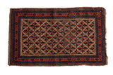 Vintage Belouch rug featuring lattice starburst and pawn motif borders in camel, red, and blue.