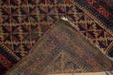 Belouch rug reverse, showing hand knotted foundation weave and slight pad residue.
