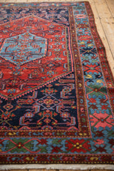Close view of Borchalou rug's sapphire Herati field and colorful geometric border.
