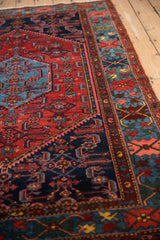 Vintage Borchalou rug with intricate Herati floral motifs and deep red, blue geometric border.