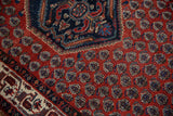 Detail showing the stepped medallion contour and staggered motifs of a vintage Persian Serbend rug.