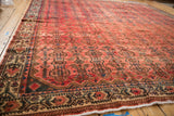 Distressed vintage Borchalou field showing even wear, raspberry floral medallions, and dark accents.