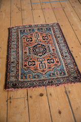 Lower right corner of the Borchalou rug showing tattered, red-tinted fringe.