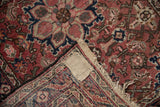 Vintage Dargezine rug corner revealing time-softened Herati pattern pile and detailed hand-woven foundation.