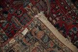 Persian Lilihan runner's folded corner displays cherry red floral pile, worn fringe, woven foundation.