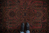Vintage Lilihan rug featuring ornate floral and paisley design in dusty raspberry, navy, gold.