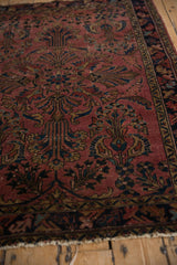 Ornate Lilihan field with paisley plants, dusty raspberry, navy, gold tones, and visible wear.
