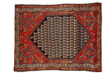 Vintage Persian Malayer rug with a navy blue medallion of botehs on a tomato red floral field.