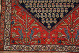 Vintage Malayer's tree-of-life corner spandrel meeting the navy blue boteh field.