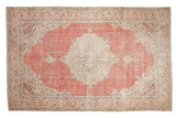 Distressed hand-knotted Turkish Sparta carpet, blush field, ivory concentric medallion, scrolling tendrils.