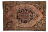 Hand-knotted distressed Oushak carpet, faded peach field, dark floral medallion.