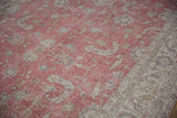 Distressed dusty raspberry field, with visible foundation and a pale coffee border.
