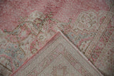 Vintage Sparta carpet's worn pink pile, revealing foundation weave and intact side cord.
