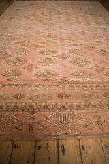 Fringed edge, intricate geometric border, and distressed elephant footprint guls on a Bokhara rug.