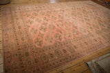 Fringed edge and geometric elephant footprint motifs on a distressed vintage Bokhara carpet.